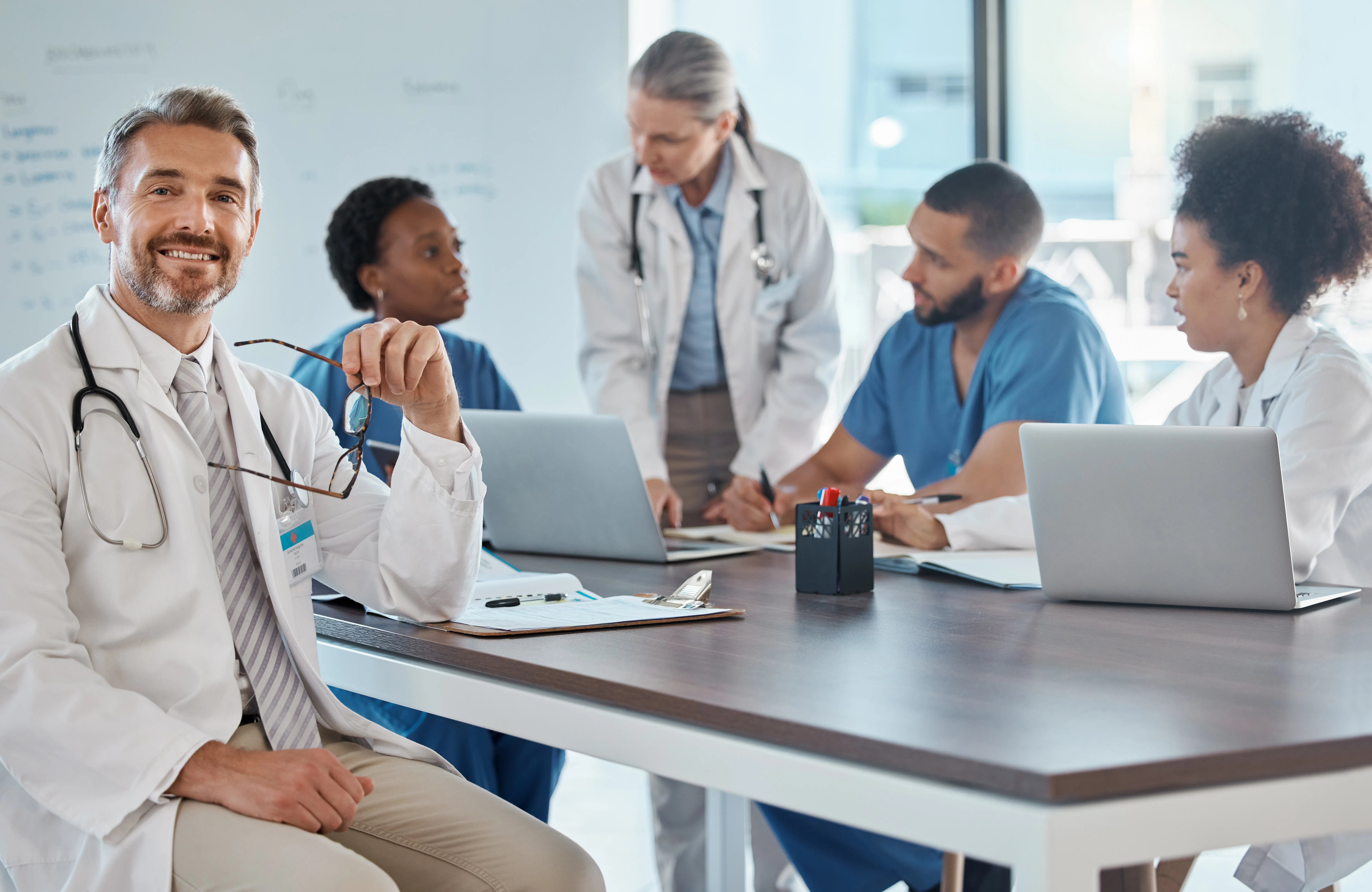 Doctor in a strategy meeting with his medical team